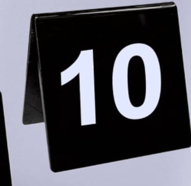 Black Acrylic Table Tent with a number 1 and 10 white font