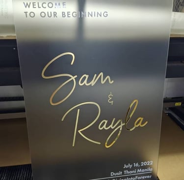 Elegant frosted acrylic wedding sign with gold script for Sam & Rayla, Dusit Thani Manila