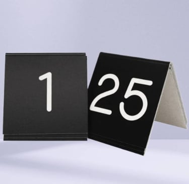 black Acrylic Table Tent with a number 1 -25 with white fonts