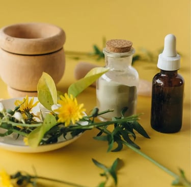 homoeopathic remedy in a bottle next to a flowers