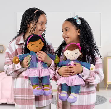 2 girls holding Aamina Desi Dolls