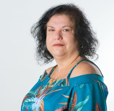 a woman with a blue dress and a necklace