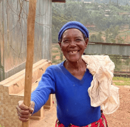 a woman Farmer in a blue shirt and red pants