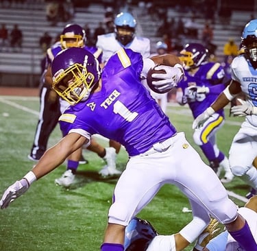 a football player is running with the ball