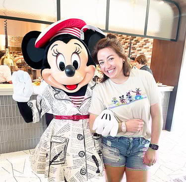 Dasee Johnson pictured with Minnie Mouse at Walt Disney World®.