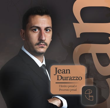 a man in a suit and tie with a business card jean durazzo