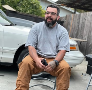 Sonoma Junkers co owner Luis sitting on a chair