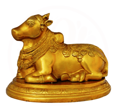 a golden cow statue of a cow in a golden color