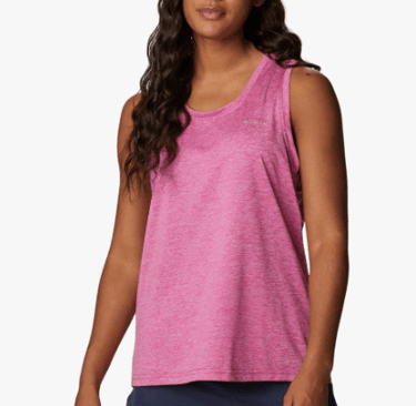 a woman in a pink tank top and shorts