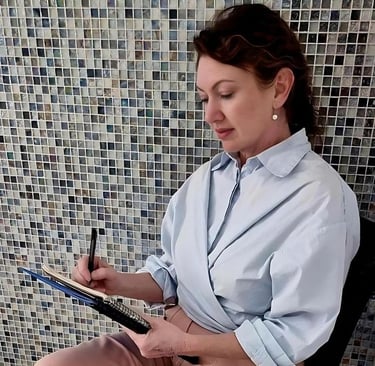 Female clinical hypnotherapist taking notes