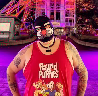 Man in a pup mask at a theme park at night.