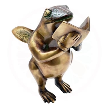a brass frog read in book