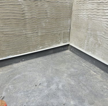 GREY RENDER ON AN EXTERNAL WALL BY D AND N PLASTERING