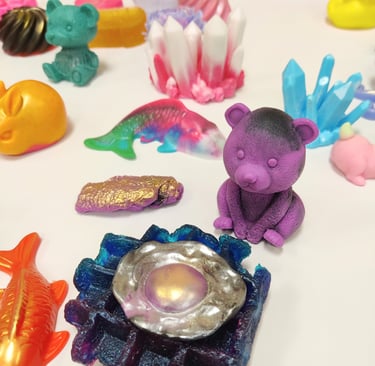 a selection of colorful soaps on a white table