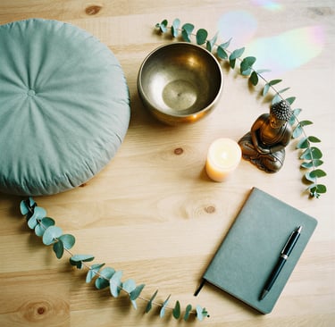 Meditation supplies flatlay with singing bowl crystals herbs natural healing mindfulness