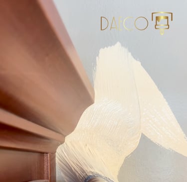 a person painting a wall with a paintbrush