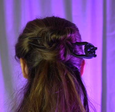 a woman with long hair and a hair comb