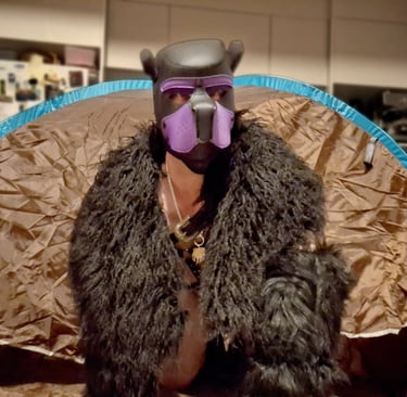 Man in bear mask and fur gear