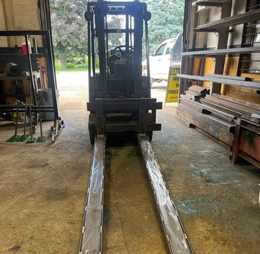 fork lift fork extensions displayed on fork lift