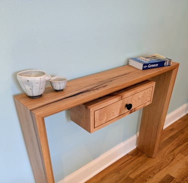 Pecan and black epoxy waterfall entry or console table with floating undermount drawer