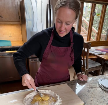 Class participant making pasta dough