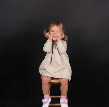Smiling baby capturing a precious moment in a beautifully styled photoshoot.
