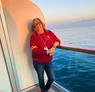 Shelly on a balcony of a Carnival Cruise to Alaska 