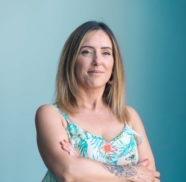 a woman with tattoos on her arms and arms crossed