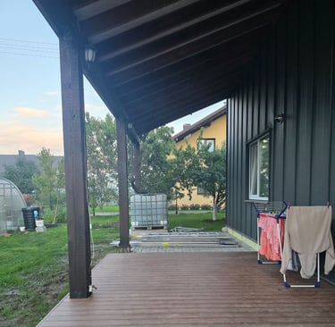 a porch with a blanket on the porch