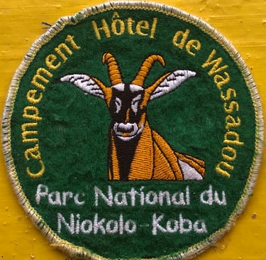 Embroidered souvenir patch for Campement Hôtel de Wassadou at Niokolo-Koba National Park featuring an antelope.