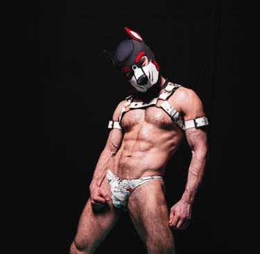 Man in harness and pup mask.