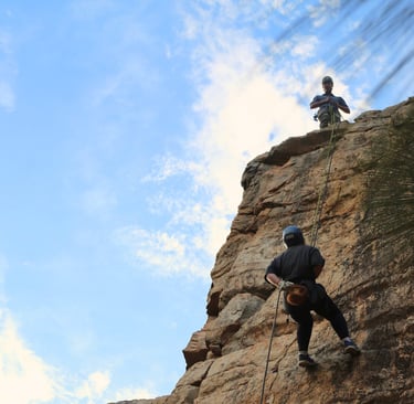 Participants abseiling down a sheer cliff during a half-day adventure at Morialta Conservation Park,