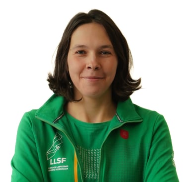 a woman in a green jacket