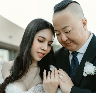 couple looking at thier rings