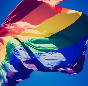 a rainbow - colored flag with a rainbow - colored flag