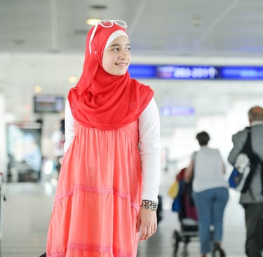 a woman in a red dress and a man in a suit for boarding