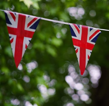 Row of triangular British flags, symbolizing international students' journey in the UK