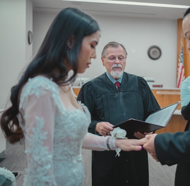 a man and woman getting married in a courtroom