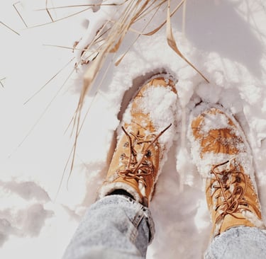 Winter boots standing ready in the snow, representing joy and courage to weather any season of life