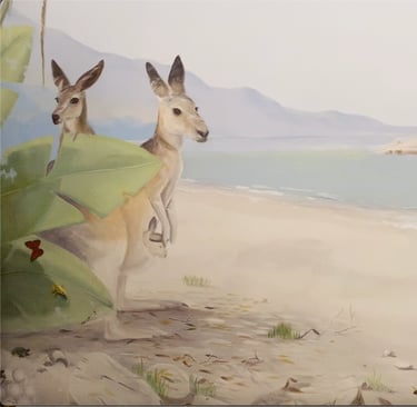 Hand-painted mural scene with kangaroos by the shore and an iguana basking in light—part of an Australian wildlife mural