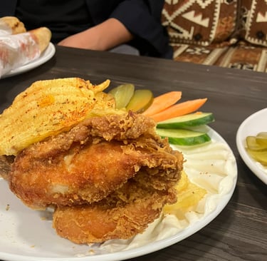 a plate of fried chicken on a table