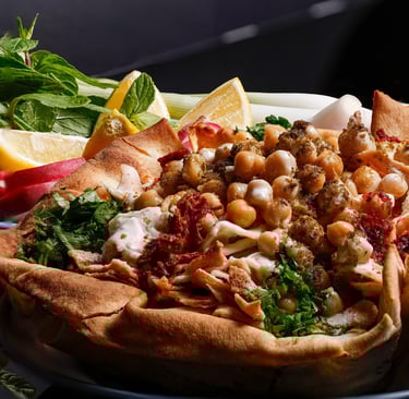 PhotoHome food photography: close-up of traditional Syrian chickpea fatteh dish.