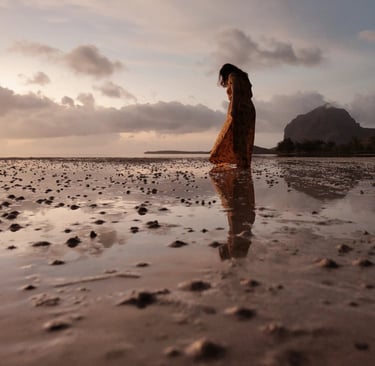 Silhouette of a woman on the beach with Le Morne Brabant in the background, Mauritius