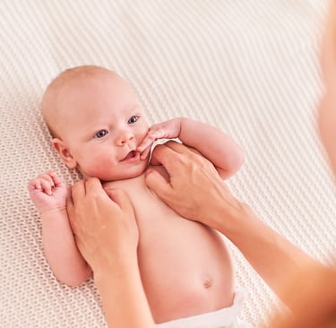 a baby is being held by a woman