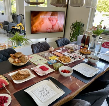 a table with plates of food and drinks