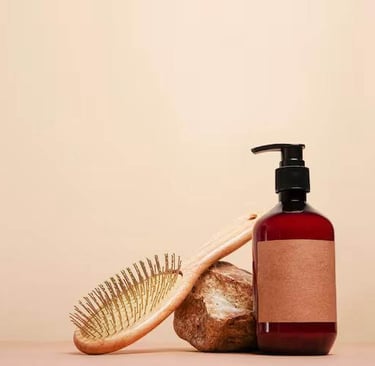 a hair brush and a bottle of hair