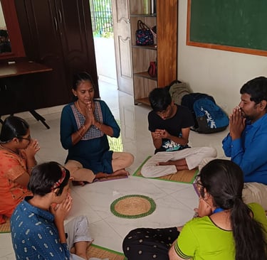 In a respectful and loving environment children are in a circle and doing morning prayer
