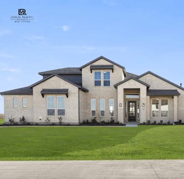 a large house with a large lawn and a driveway