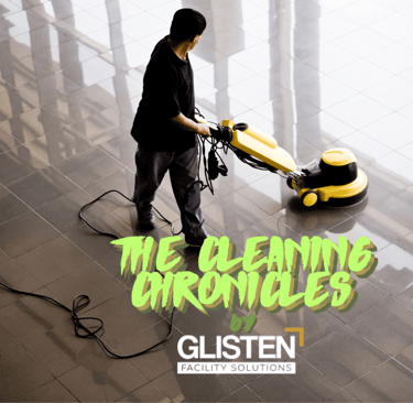 A clean, modern lobby with a janitor polishing floors.