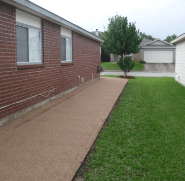 decomposed granite walkway on side of house 